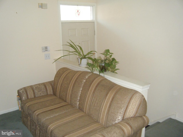 living area featuring baseboards