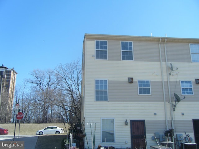 back of property with central air condition unit