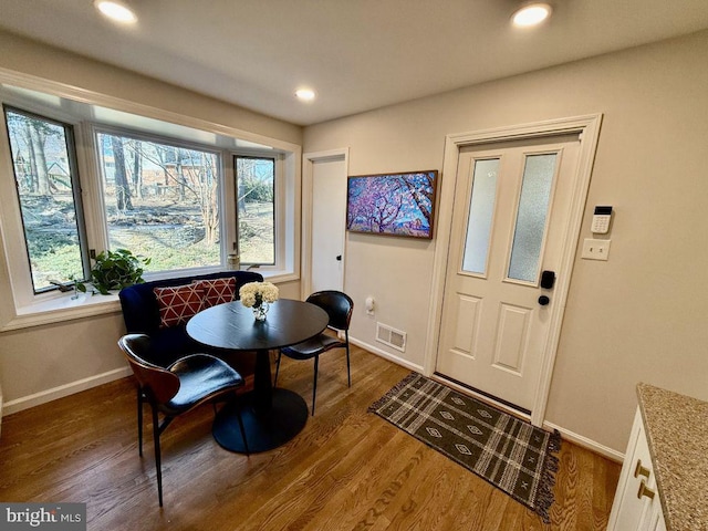 dining room featuring visible vents, recessed lighting, baseboards, and wood finished floors