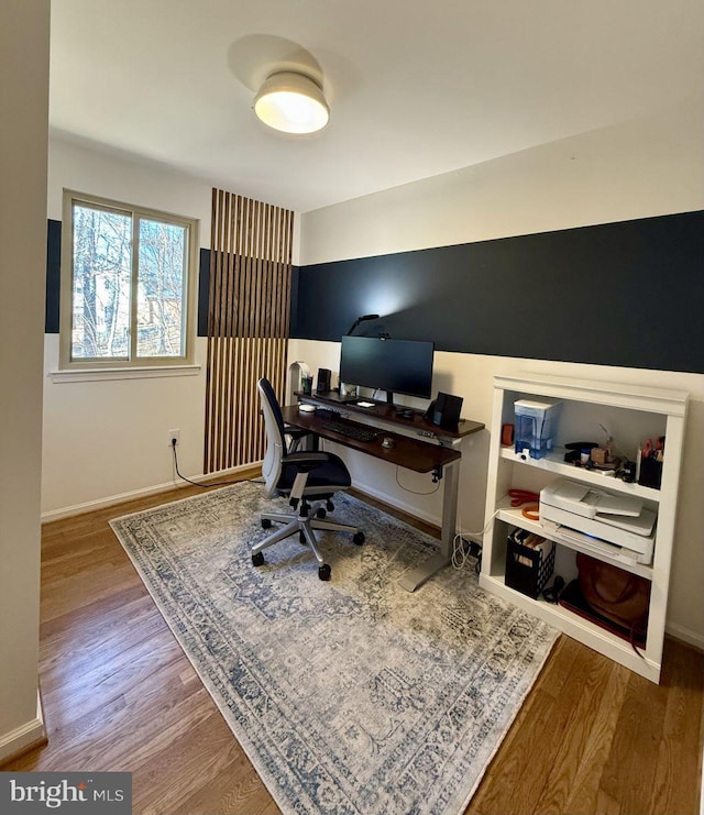 office with baseboards and wood finished floors