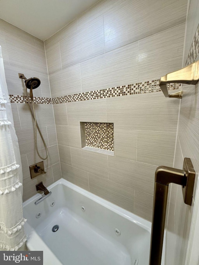 bathroom featuring a combined bath / shower with jetted tub