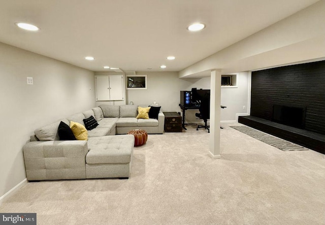 living area with carpet flooring, recessed lighting, and baseboards