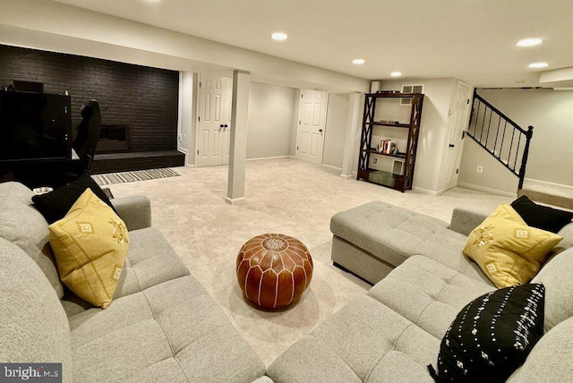 carpeted living area with stairs, visible vents, recessed lighting, and baseboards