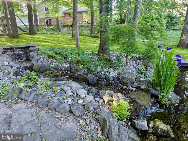 view of yard featuring fence