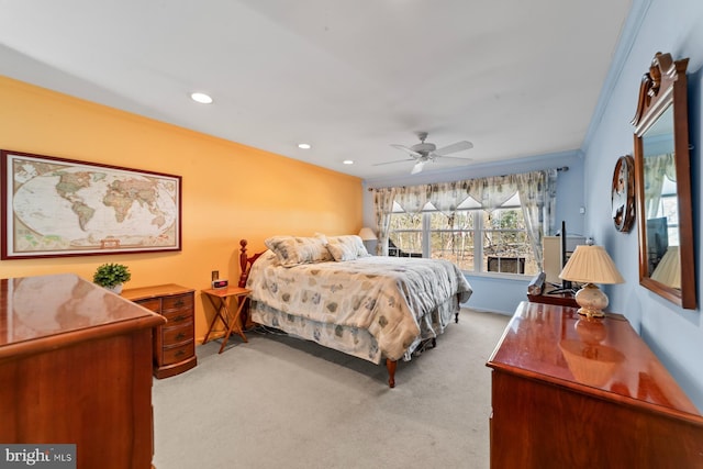 bedroom featuring a ceiling fan, crown molding, recessed lighting, and carpet