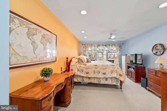 bedroom featuring recessed lighting, light colored carpet, ornamental molding, and a ceiling fan