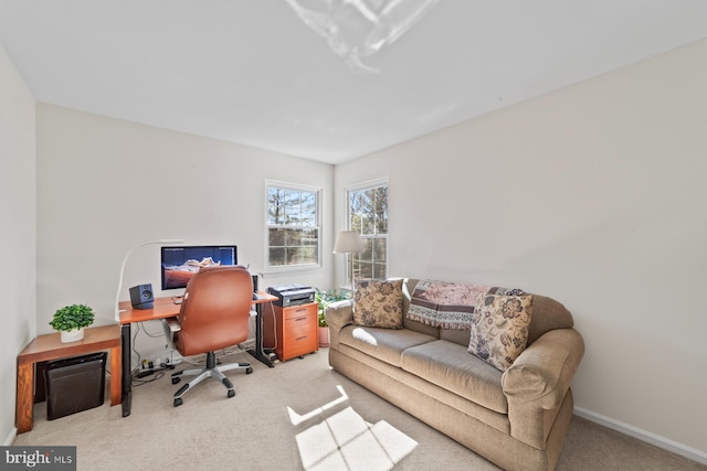 office space with light colored carpet and baseboards