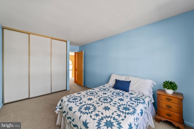 bedroom featuring a closet and carpet floors