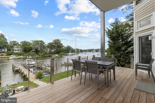 deck featuring a water view and outdoor dining space