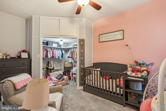3144 Gaul St, Philadelphia, PA 19134 - carpeted bedroom featuring a closet, a crib, ceiling fan, and a textured ceiling