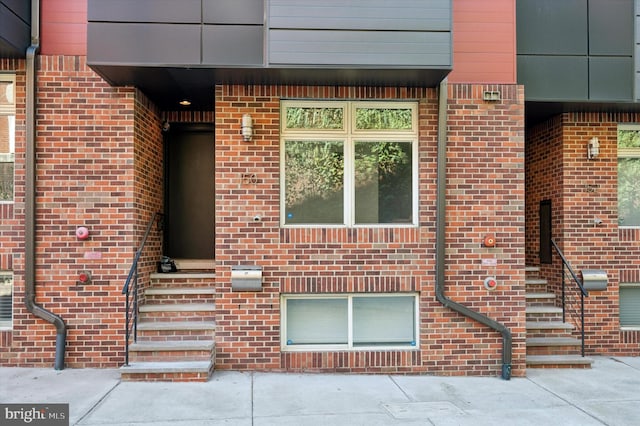 entrance to property with brick siding