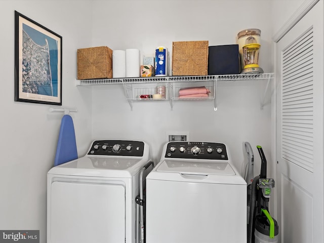 laundry area with separate washer and dryer and laundry area