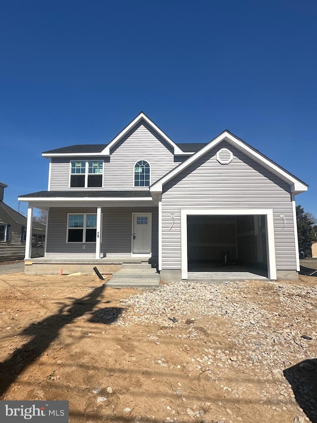 view of front of home with a porch and an attached garage