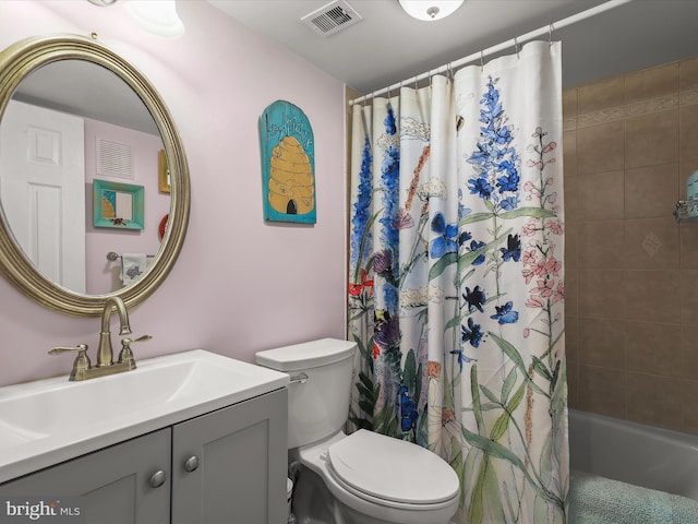 full bath with visible vents, toilet, shower / bath combo, and vanity