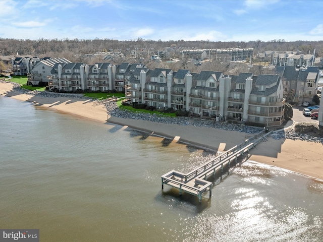 bird's eye view with a residential view and a water view