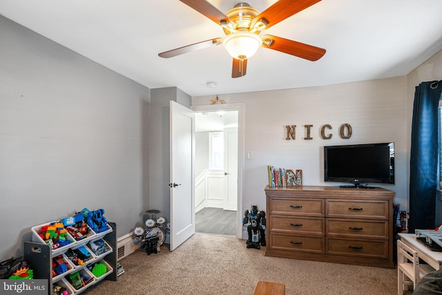 interior space with light colored carpet and ceiling fan