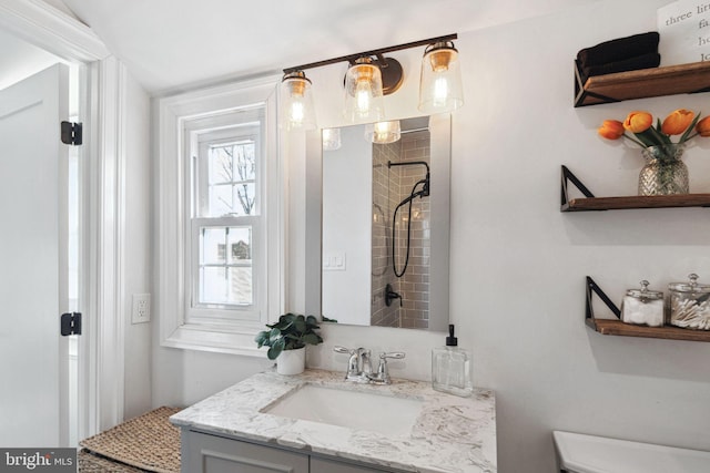 full bath with vanity and a tile shower