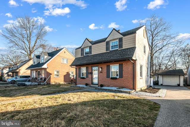 view of front facade with driveway, an outdoor structure, a shingled roof, a garage, and brick siding