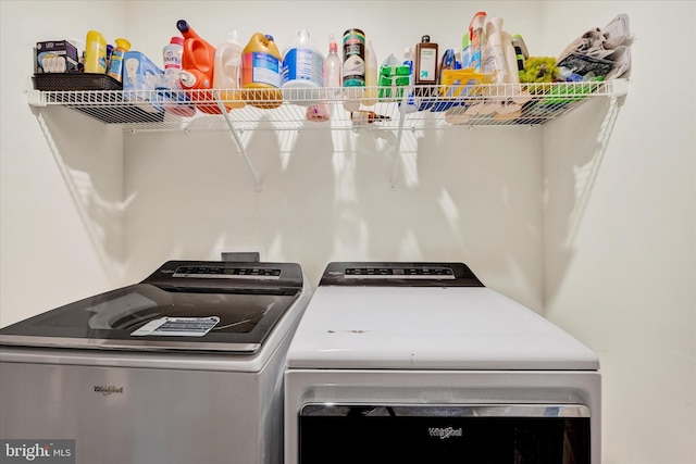 washroom featuring washing machine and dryer