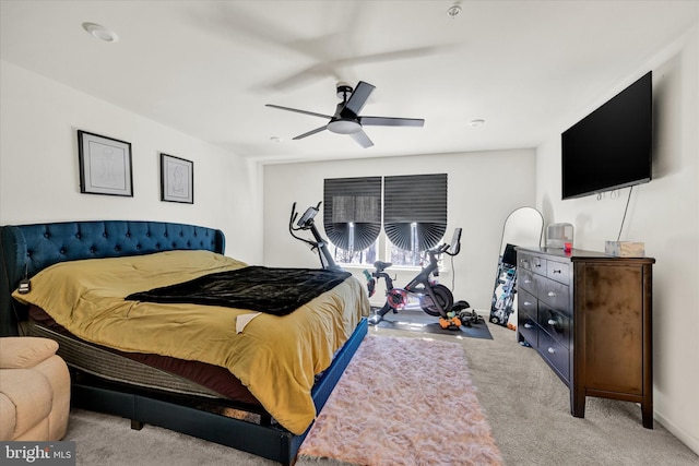 carpeted bedroom with baseboards and ceiling fan