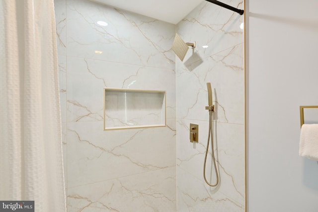 full bathroom featuring a marble finish shower