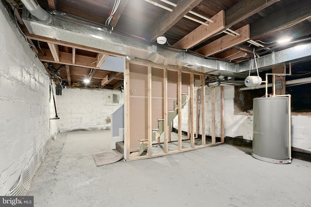 unfinished basement featuring gas water heater