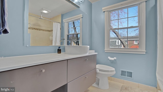 bathroom with visible vents, toilet, curtained shower, vanity, and tile patterned flooring