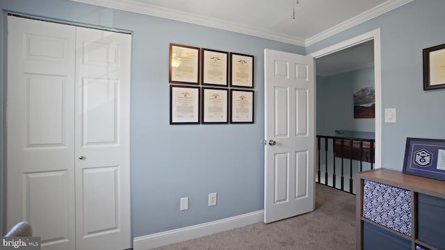 bedroom with baseboards, ornamental molding, and carpet