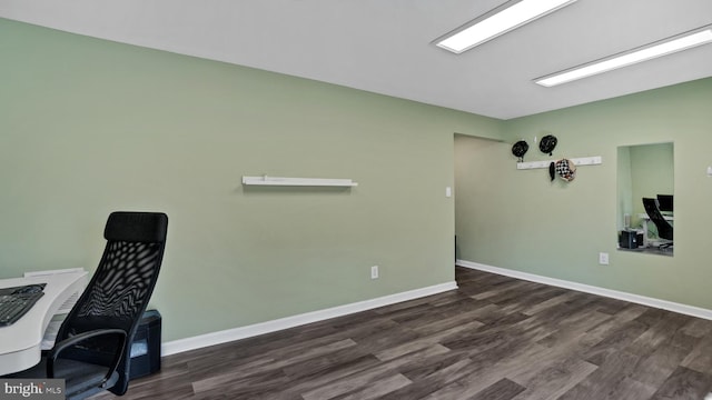 office space featuring baseboards and dark wood finished floors