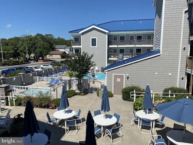 surrounding community with a patio area and fence