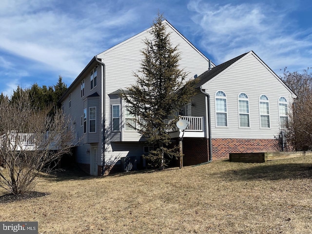 view of side of home featuring a lawn