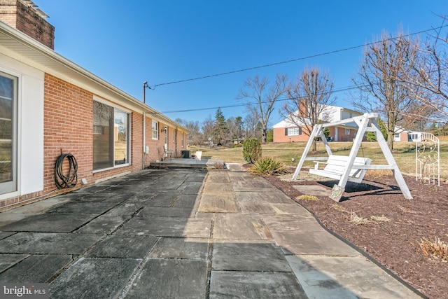 view of patio featuring a playground