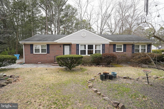 single story home featuring crawl space, brick siding, and a shingled roof