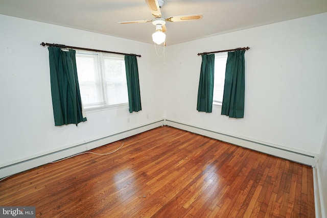 spare room featuring wood-type flooring and ceiling fan