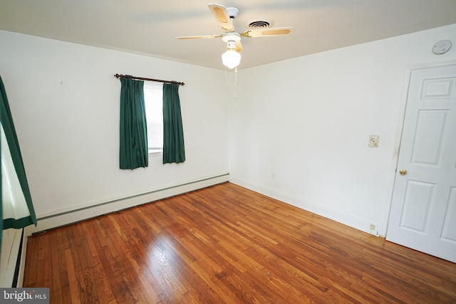 unfurnished room with visible vents, a baseboard heating unit, hardwood / wood-style floors, baseboards, and ceiling fan