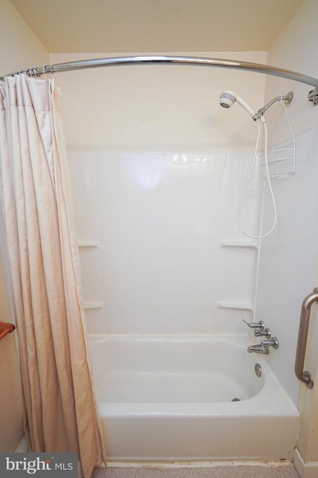 bathroom featuring shower / bath combination with curtain