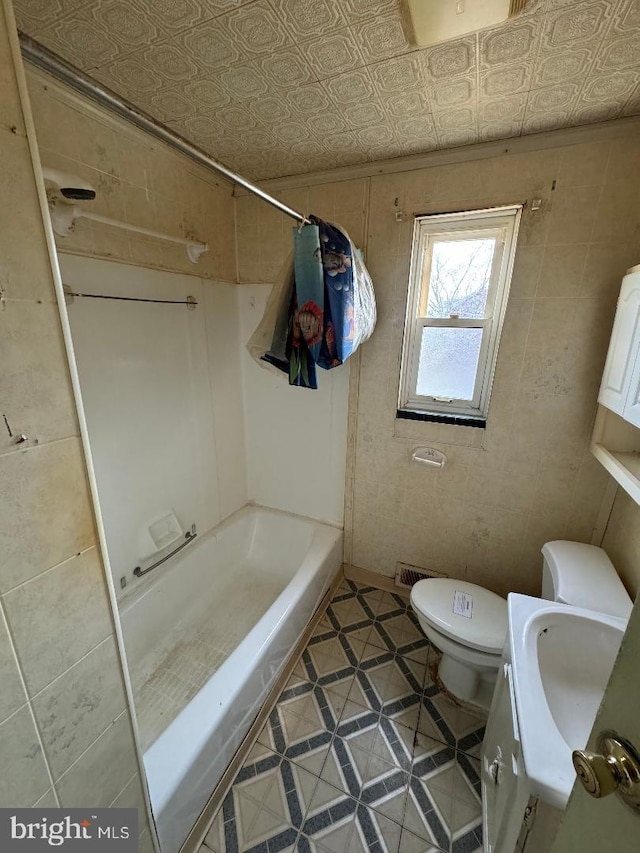 full bath with vanity, bathing tub / shower combination, toilet, and an ornate ceiling