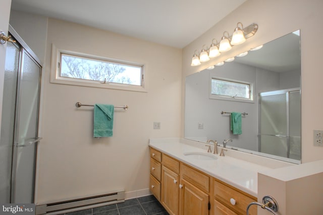 bathroom featuring a shower with door, tile patterned flooring, baseboards, baseboard heating, and vanity