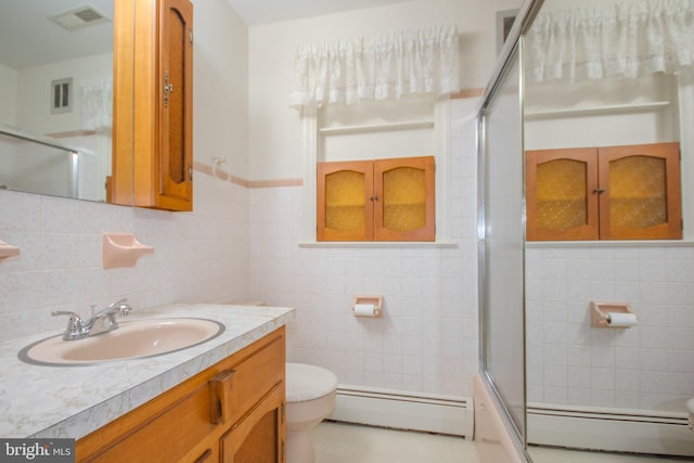 full bathroom with toilet, visible vents, and baseboard heating