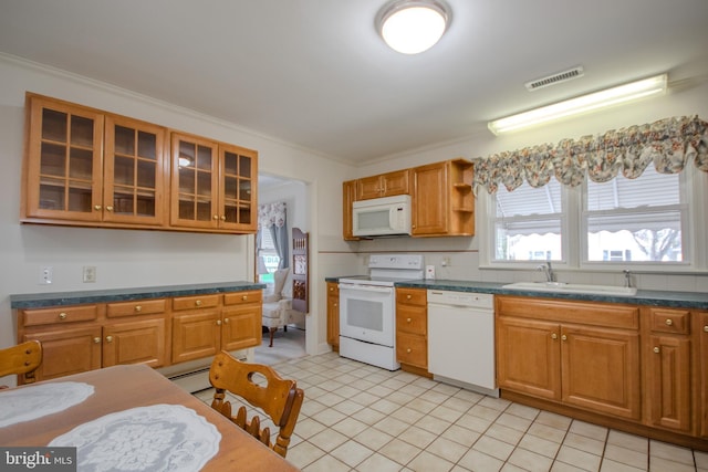 kitchen with visible vents, ornamental molding, white appliances, and a sink