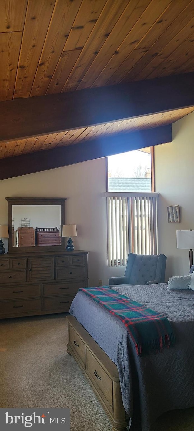 bedroom with beam ceiling, wood ceiling, and carpet flooring