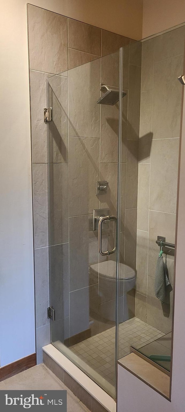 bathroom with a shower stall