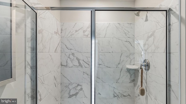 bathroom featuring a shower stall