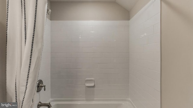 bathroom featuring shower / bathtub combination with curtain