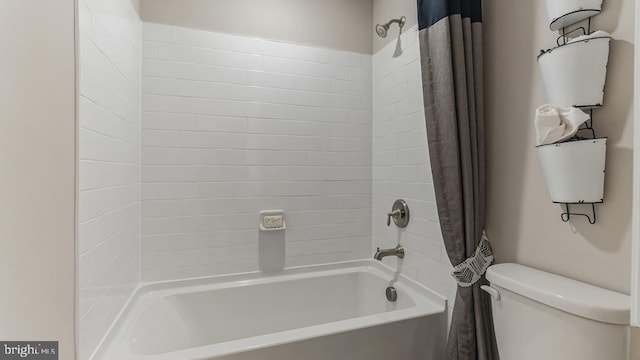 full bathroom with toilet and shower / bath combo