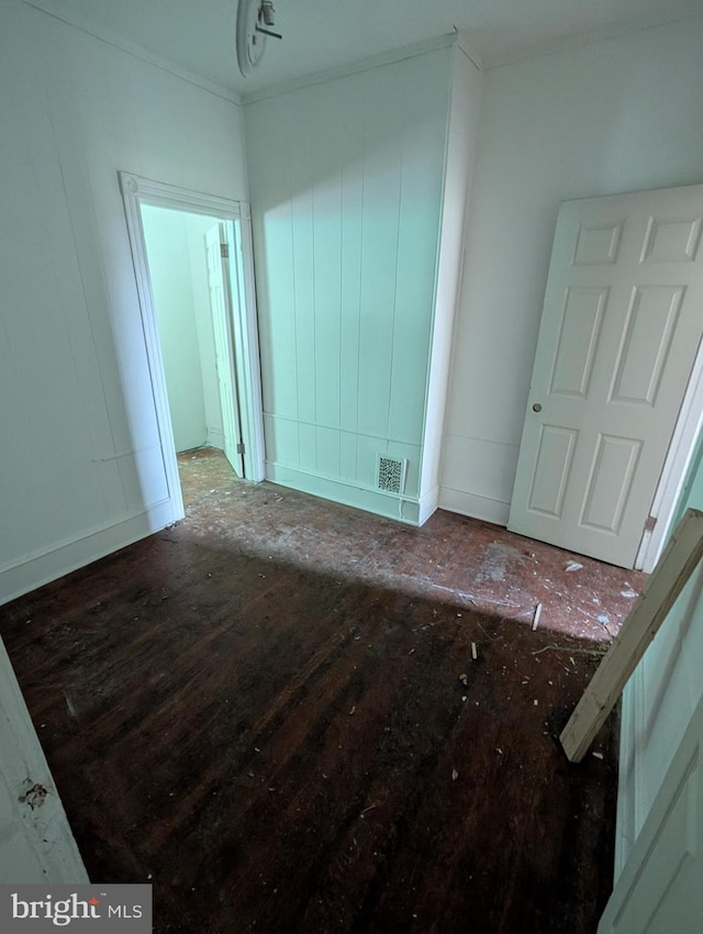 spare room featuring crown molding and visible vents