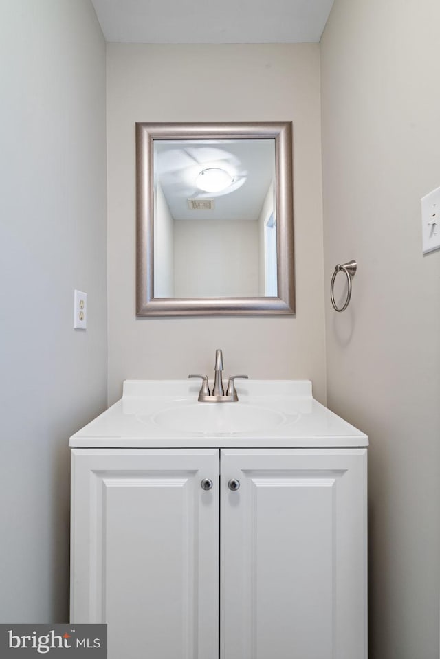 bathroom with visible vents and vanity