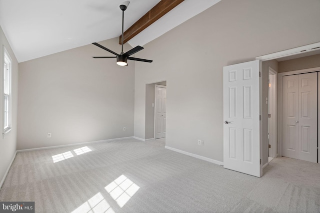 unfurnished bedroom featuring light carpet, beamed ceiling, high vaulted ceiling, and baseboards