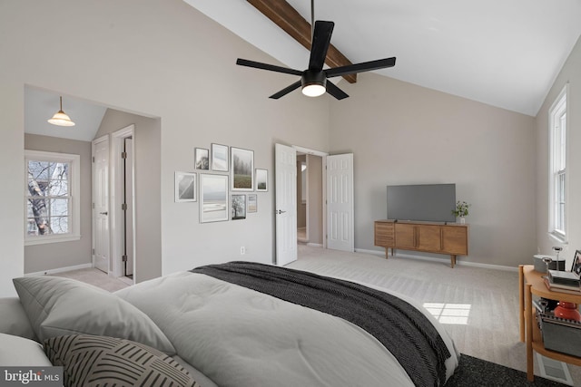 bedroom featuring a ceiling fan, carpet, baseboards, and high vaulted ceiling