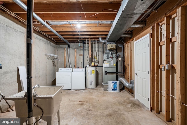 unfinished basement featuring a sink, heating unit, washing machine and dryer, and electric water heater